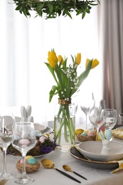 Beautiful Easter table setting with festive decor indoors