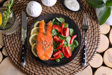 Photo of Healthy meal. Tasty grilled salmon with vegetables and lemon served on wooden table, flat lay