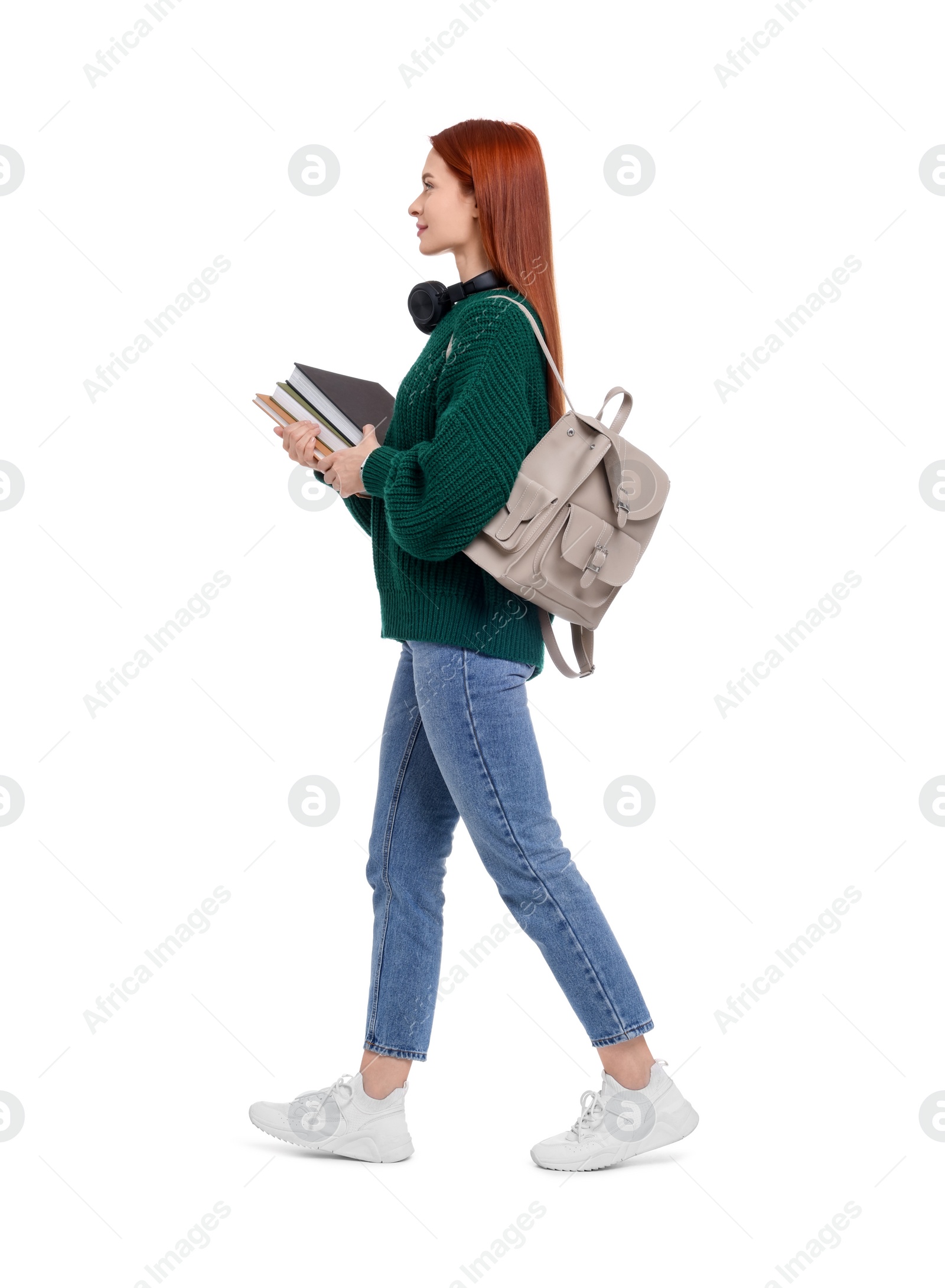Photo of Woman with backpack and books on white background