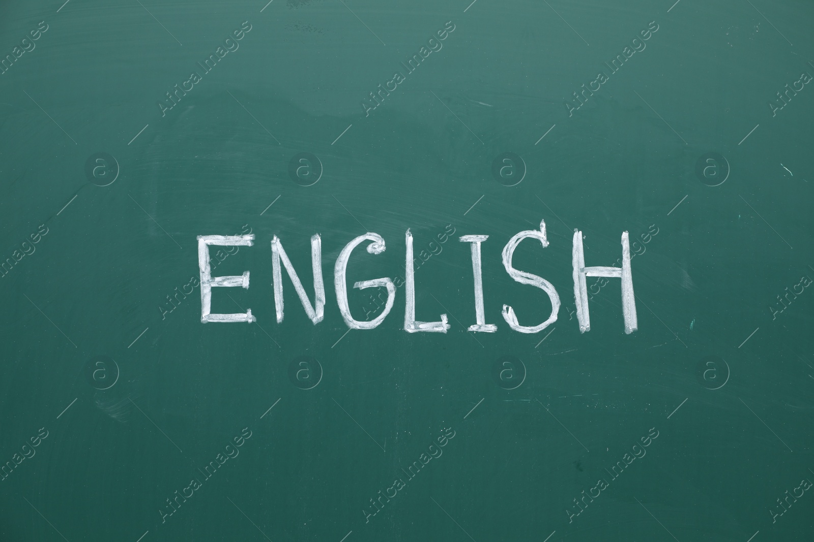 Photo of Word English written with chalk on green board