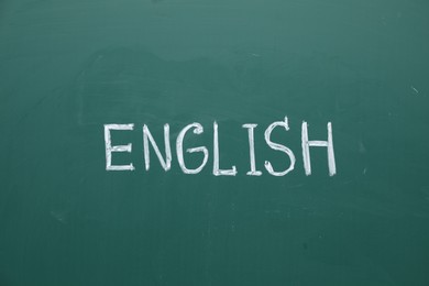 Photo of Word English written with chalk on green board