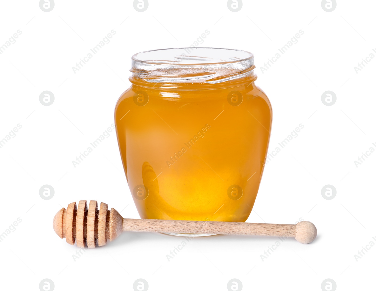 Photo of Tasty natural honey in glass jar and dipper isolated on white