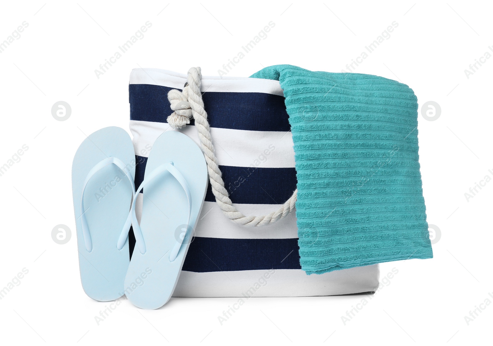 Photo of Stylish bag with beach accessories isolated on white