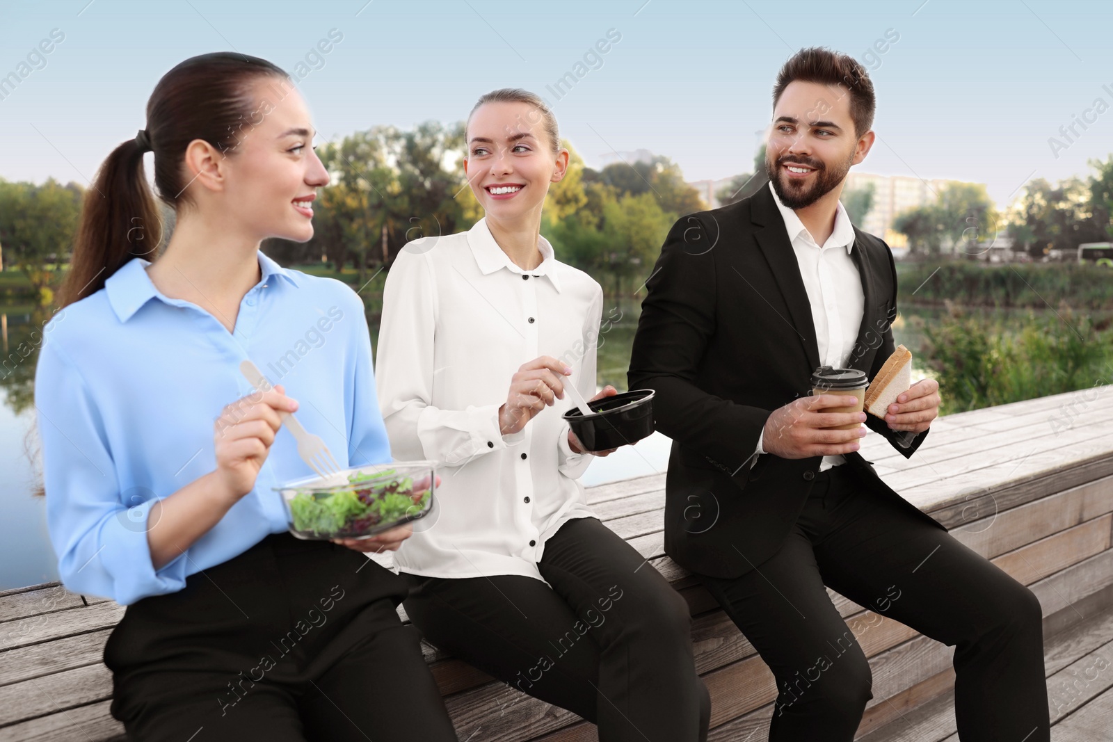 Photo of Business people spending time together during lunch outdoors