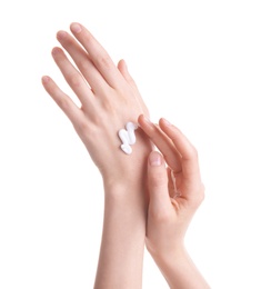 Photo of Young woman applying hand cream against on white background