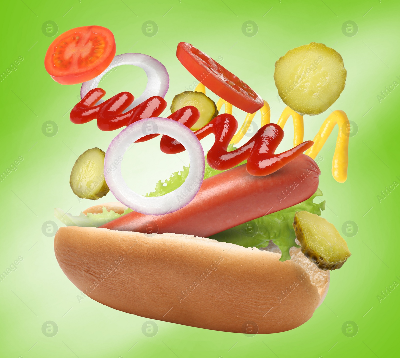 Image of Hot dog ingredients in air on green gradient background