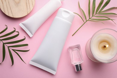 Photo of Flat lay composition with different hand care cosmetic products on pink background