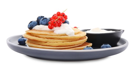 Photo of Tasty pancakes with natural yogurt, blueberries and red currants on white background