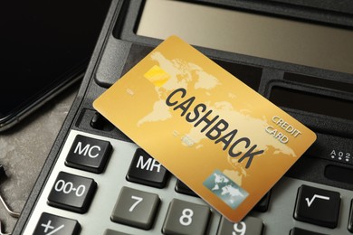 Image of Cashback credit card and calculator, closeup view