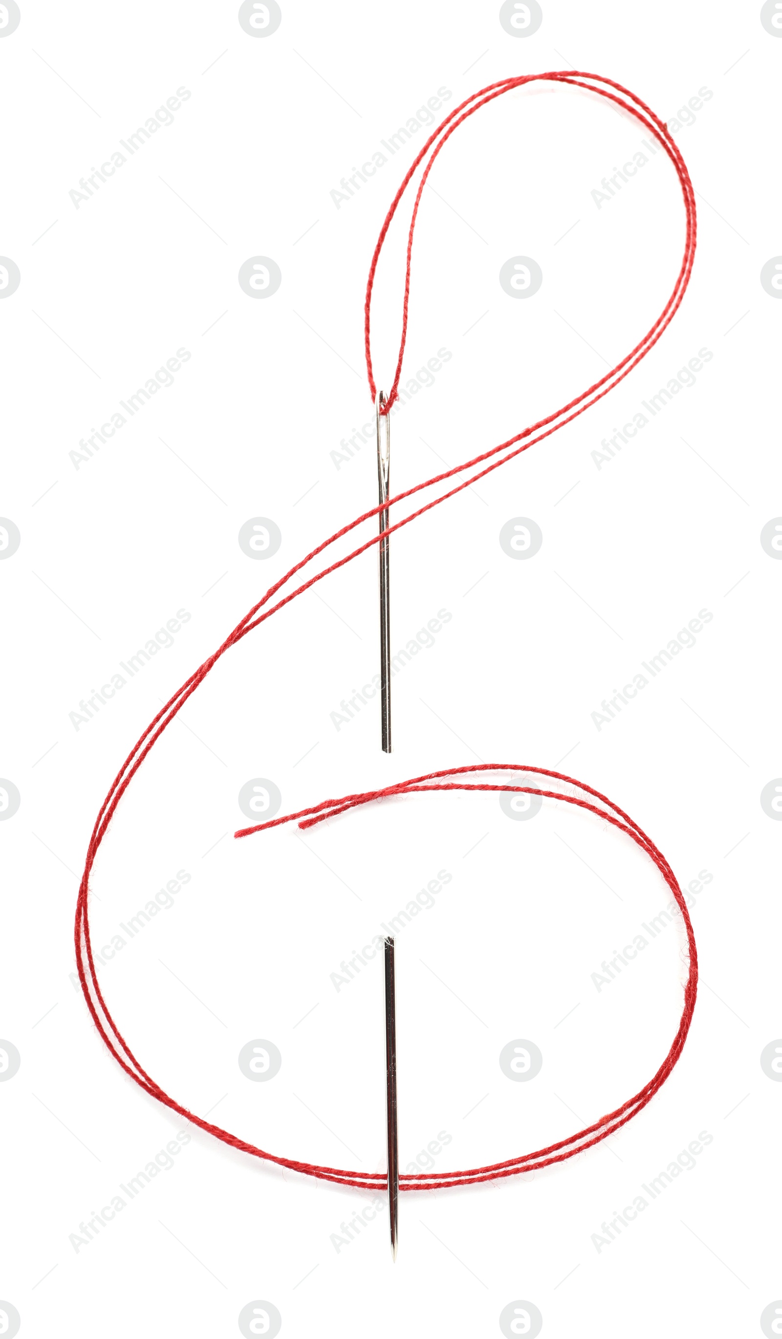 Photo of Shape of treble clef made with sewing needle and red thread isolated on white, top view