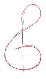 Shape of treble clef made with sewing needle and red thread isolated on white, top view