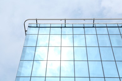 Modern building against blue sky, low angle view. Urban architecture