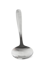 Photo of New clean shiny spoon isolated on white