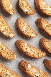 Photo of Traditional Italian almond biscuits (Cantucci) on light table, flat lay