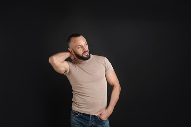 Photo of Portrait of handsome man on black background