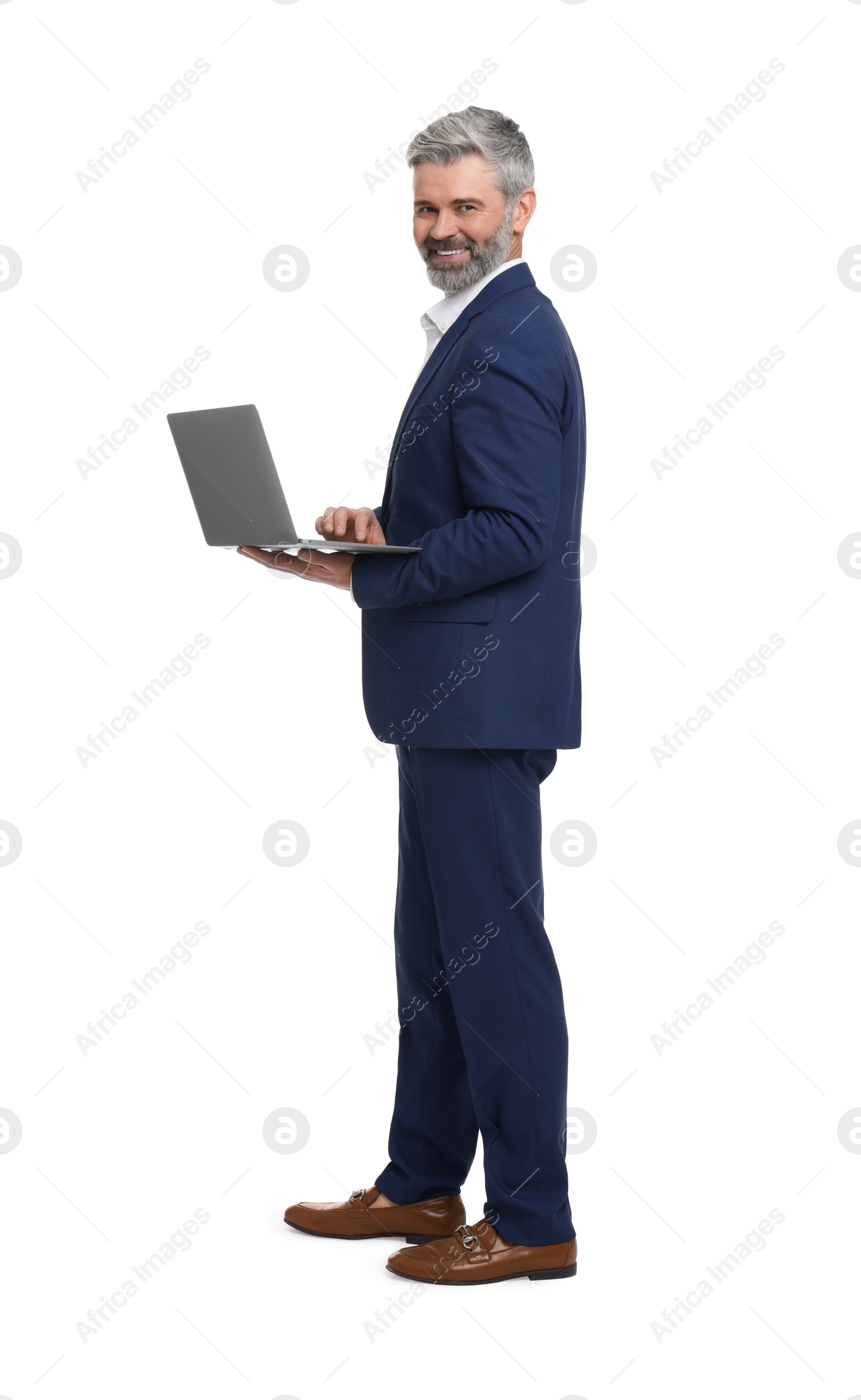 Photo of Mature businessman in stylish clothes with laptop on white background