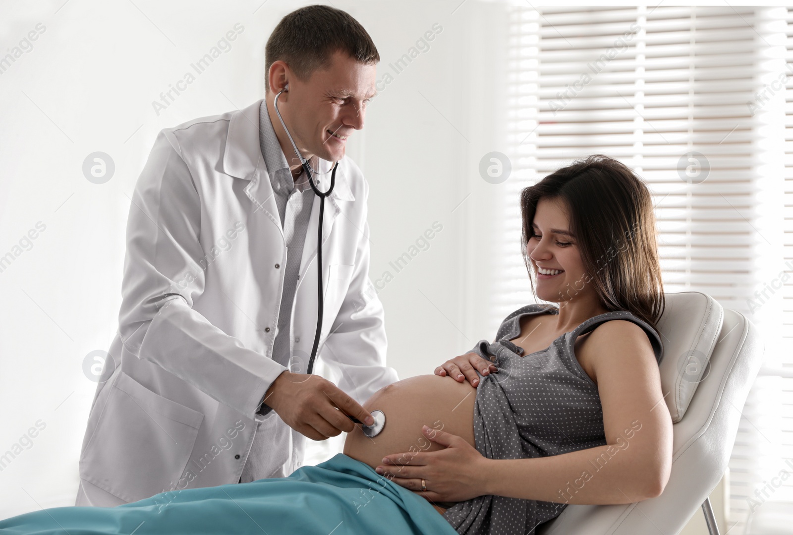 Photo of Doctor examining woman before giving child birth in maternity hospital