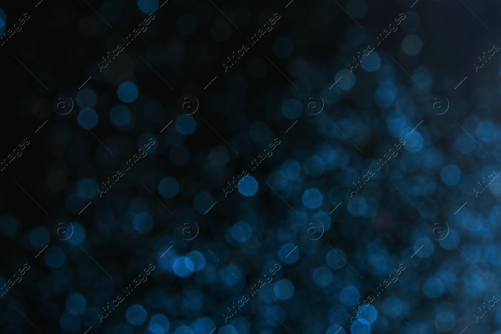 Photo of Color glitter on dark background. Bokeh effect