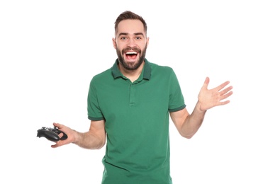 Emotional young man playing video games with controller isolated on white