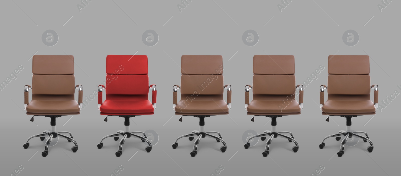 Image of Vacant position. Red office chair among brown ones on grey background, banner design