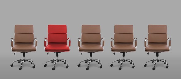 Image of Vacant position. Red office chair among brown ones on grey background, banner design