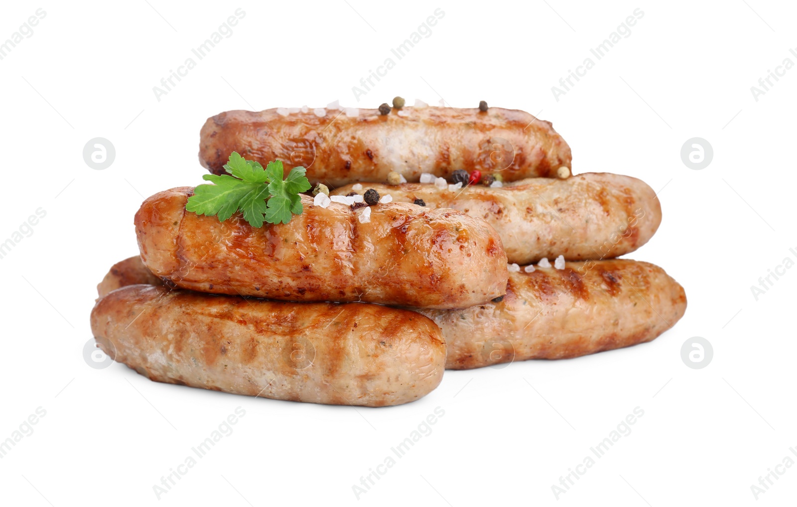 Photo of Tasty grilled sausages with spices and parsley isolated on white