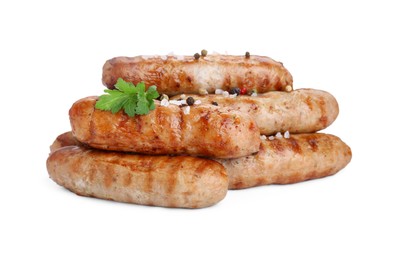 Photo of Tasty grilled sausages with spices and parsley isolated on white