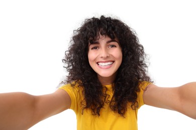 Photo of Beautiful young woman taking selfie on white background