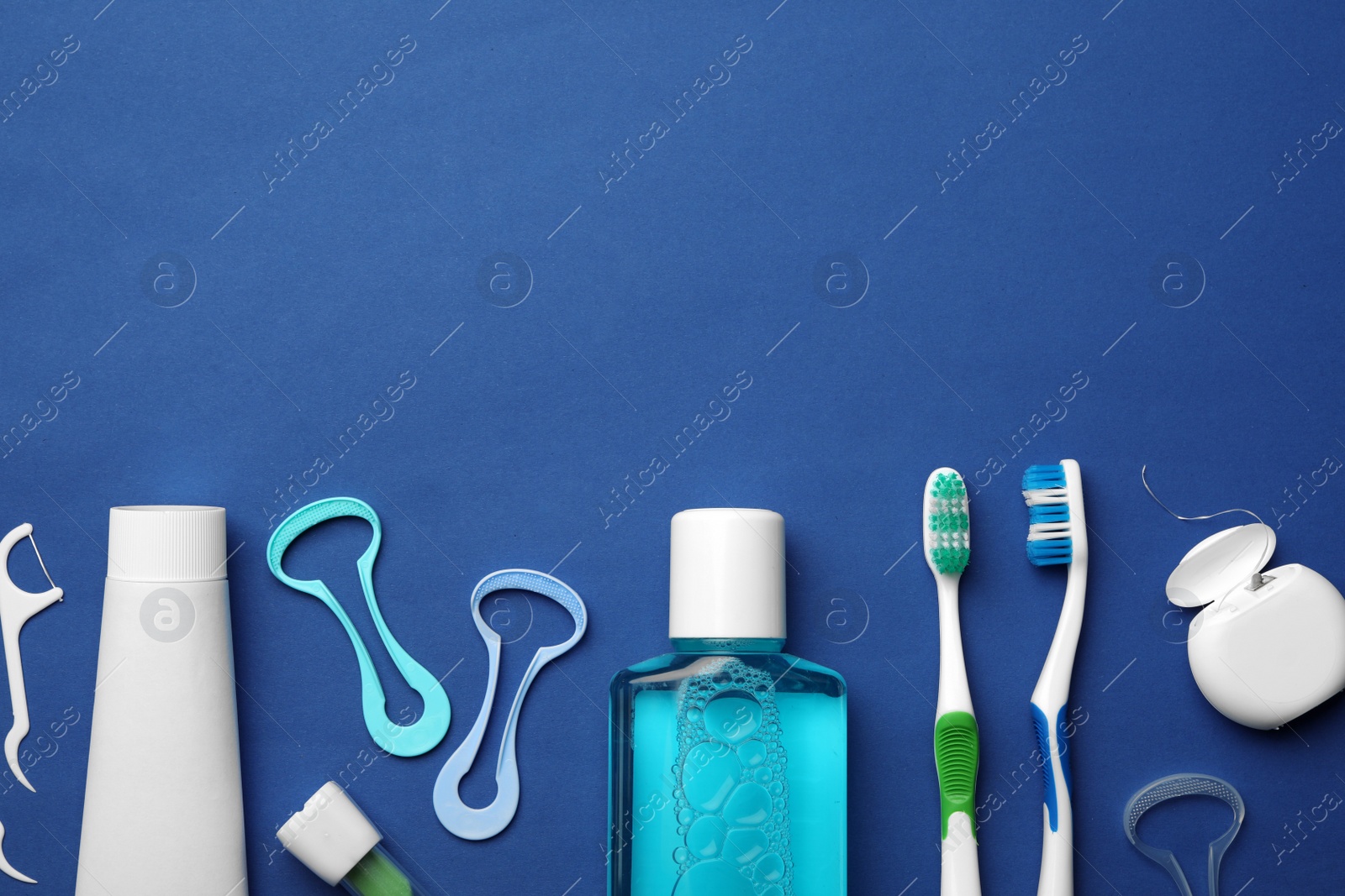 Photo of Flat lay composition with tongue cleaner on color background, space for text