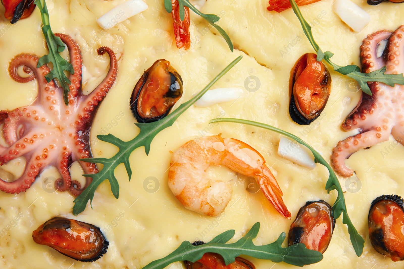 Photo of Delicious seafood pizza as background, top view