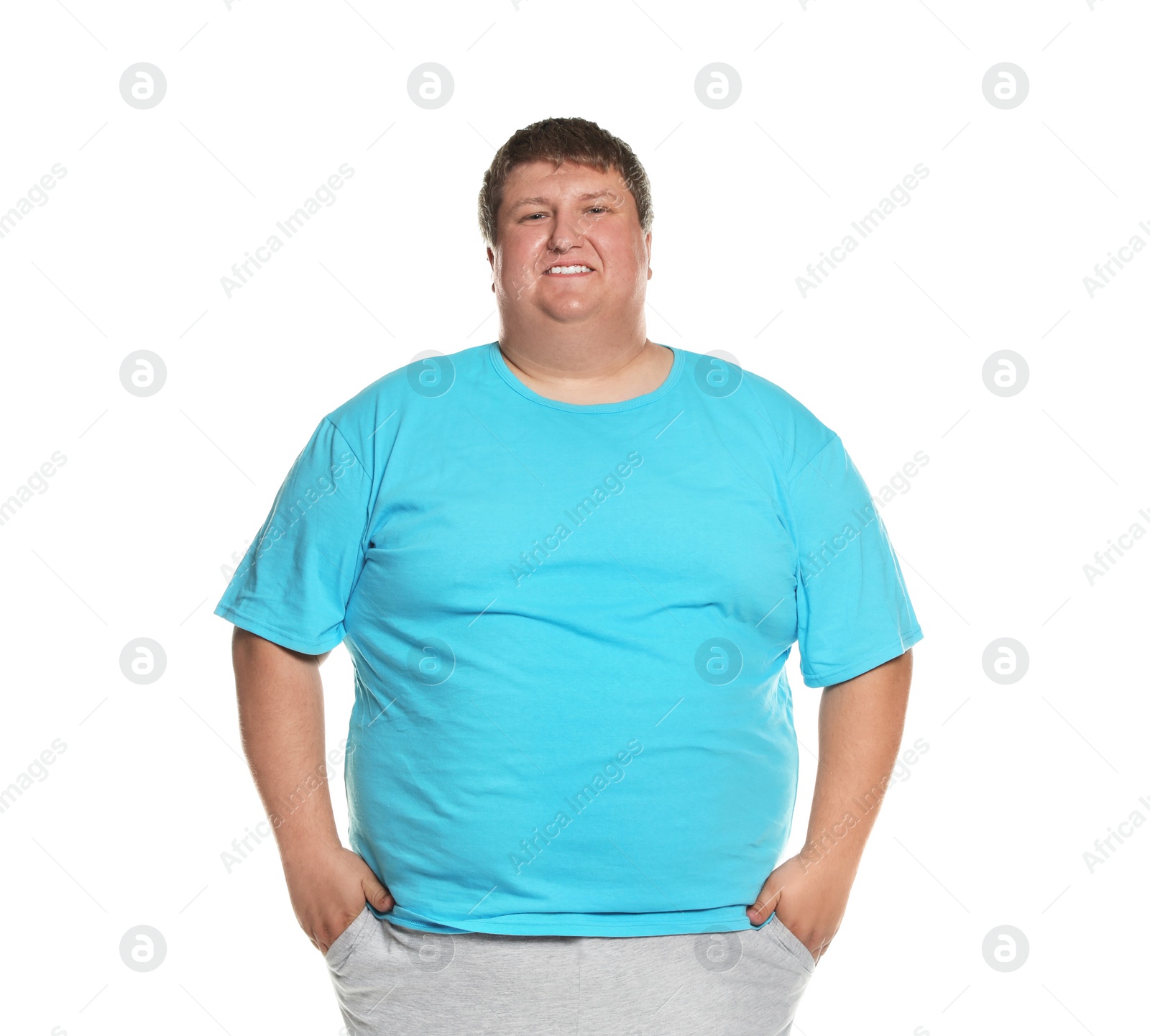 Photo of Portrait of overweight man posing on white background