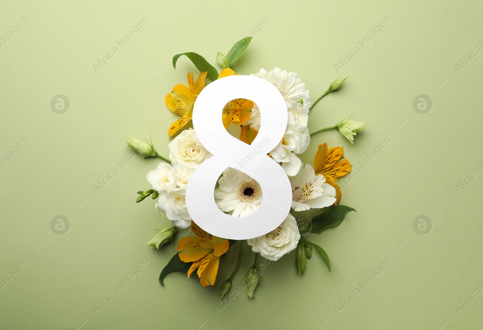 Photo of 8 March greeting card design with beautiful flowers on green background, flat lay. International Women's day