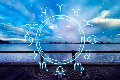 Image of Zodiac wheel and beautiful view on wooden pier under cloudy sky