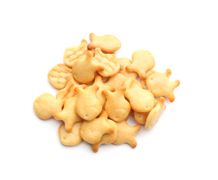 Photo of Delicious crispy goldfish crackers on white background, top view