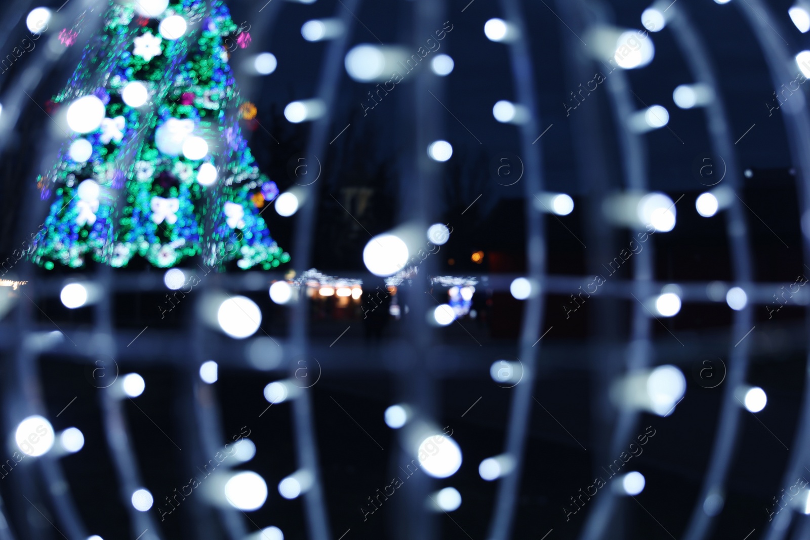 Photo of Beautiful bright Christmas decor outdoors. Bokeh effect