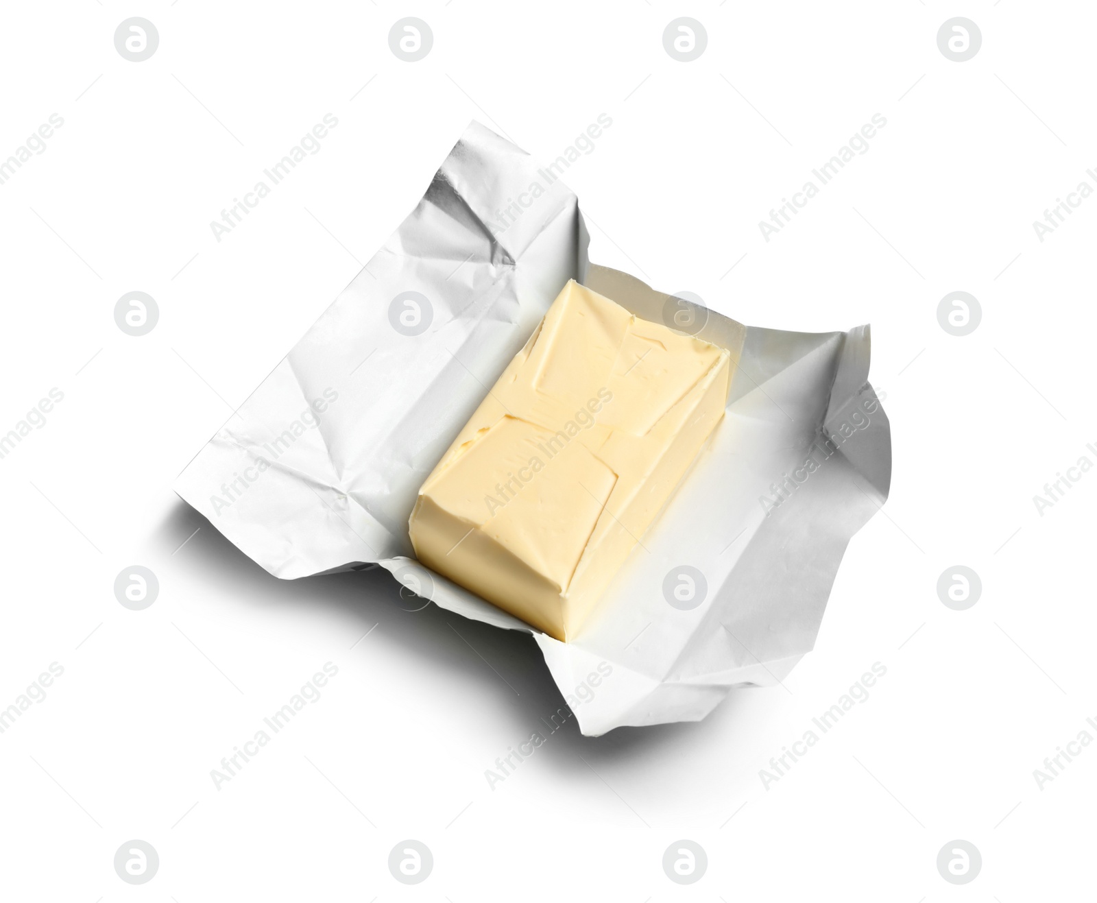 Photo of Unwrapped block of fresh butter on white background