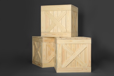 Wooden crates on dark background. Shipping containers