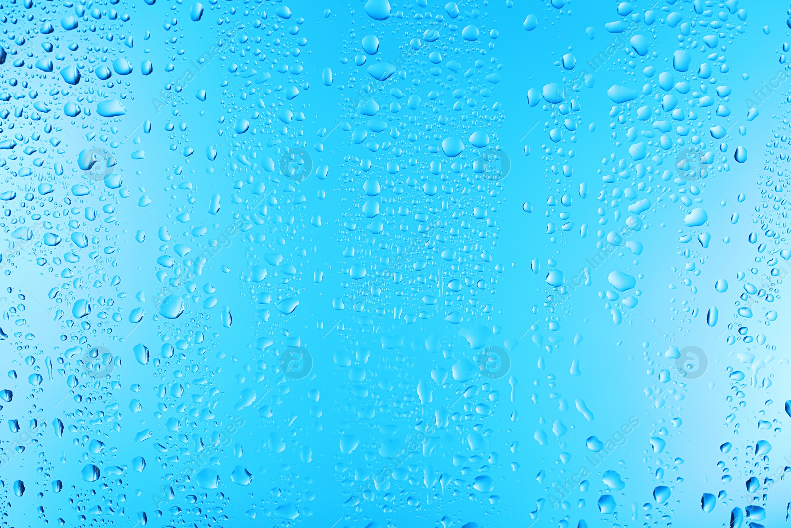 Photo of View of glass with water drops, closeup