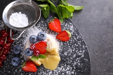 Tasty vanilla fondant with white chocolate and berries on grey table, flat lay. Space for text