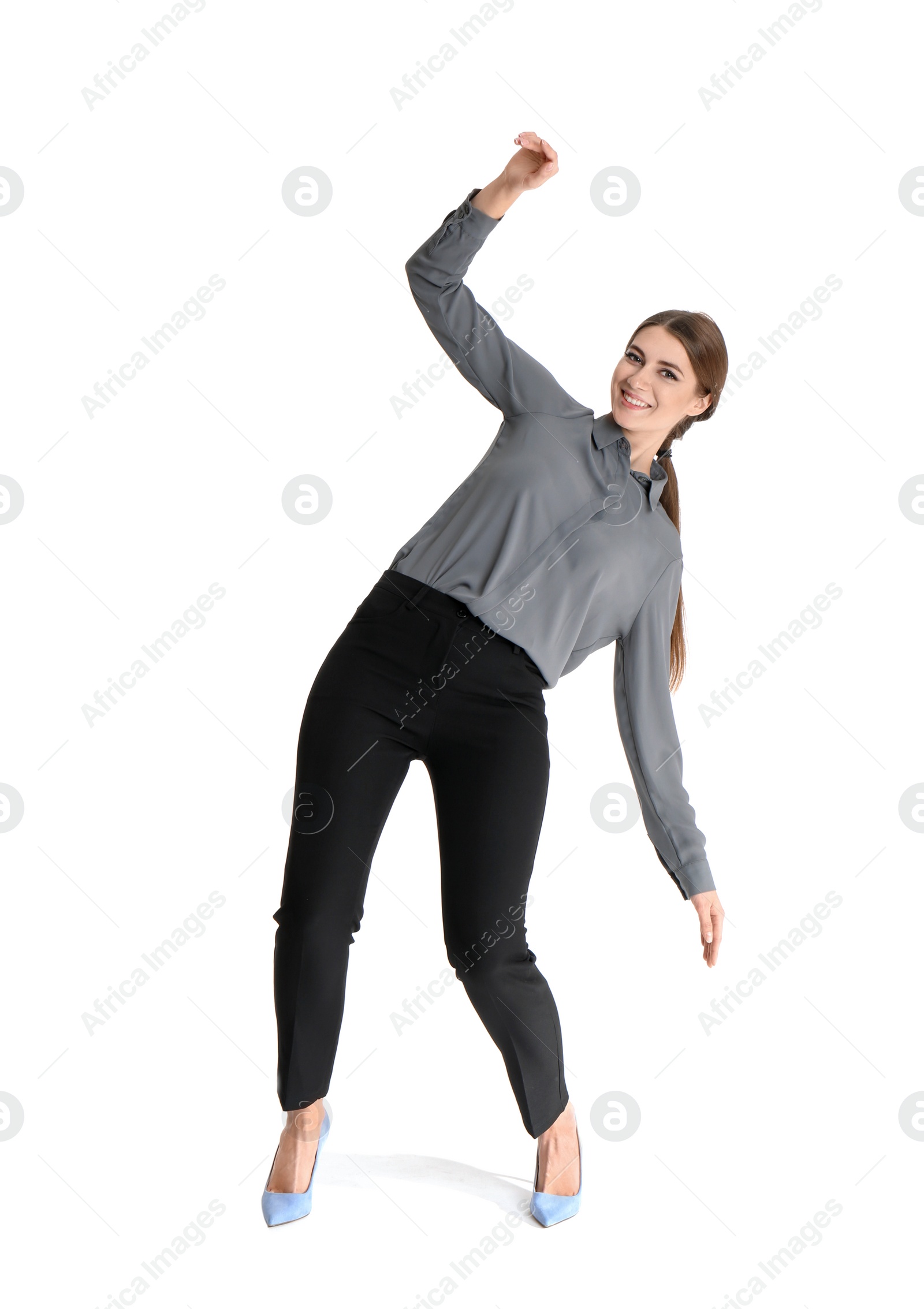 Photo of Young woman attracted to magnet on white background