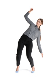 Young woman attracted to magnet on white background