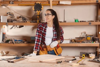 Photo of Professional carpenter with set of tools in workshop