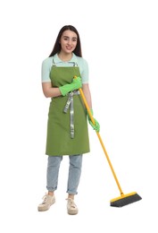 Beautiful young woman with broom on white background