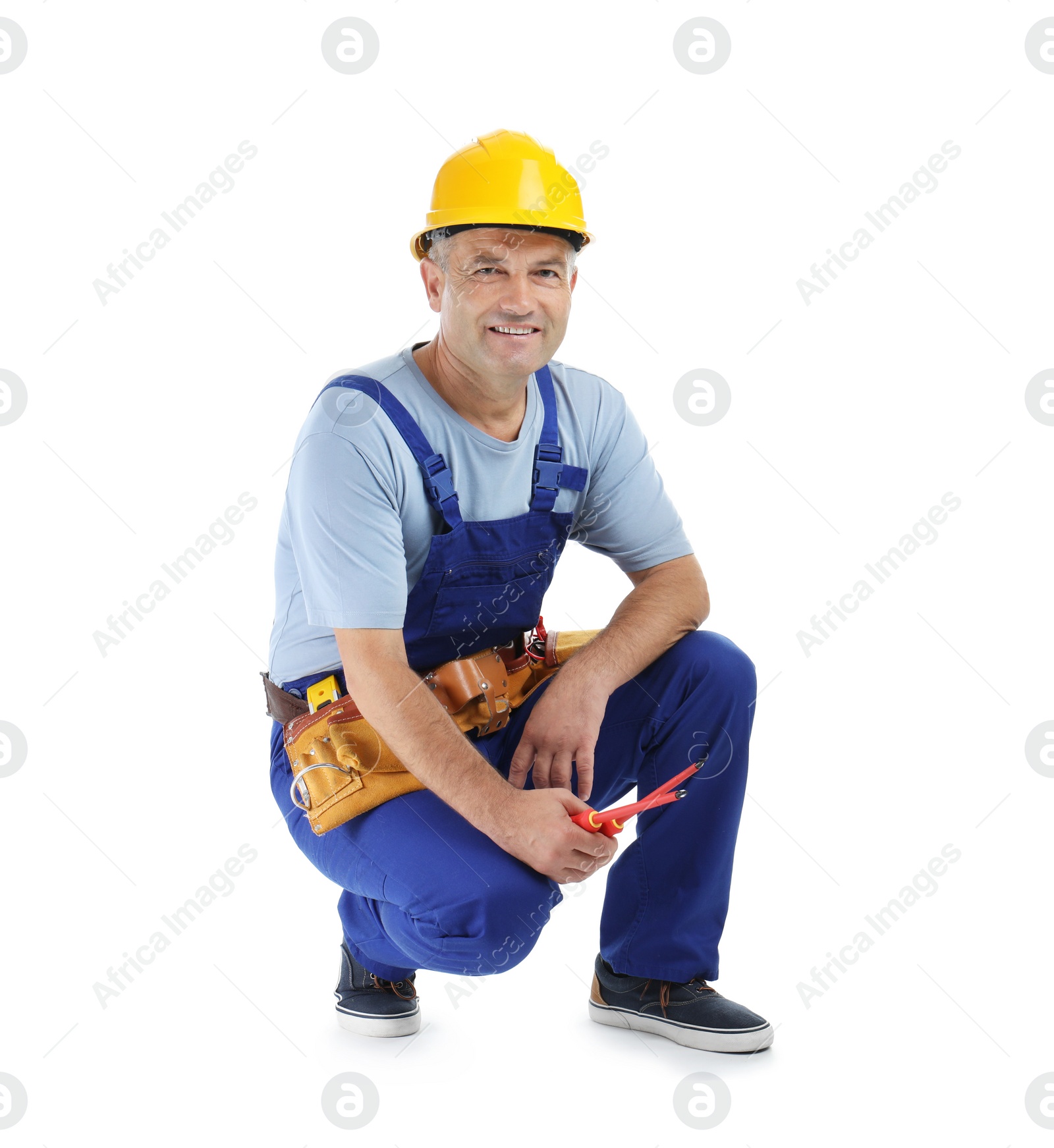 Photo of Electrician with tools wearing uniform on white background