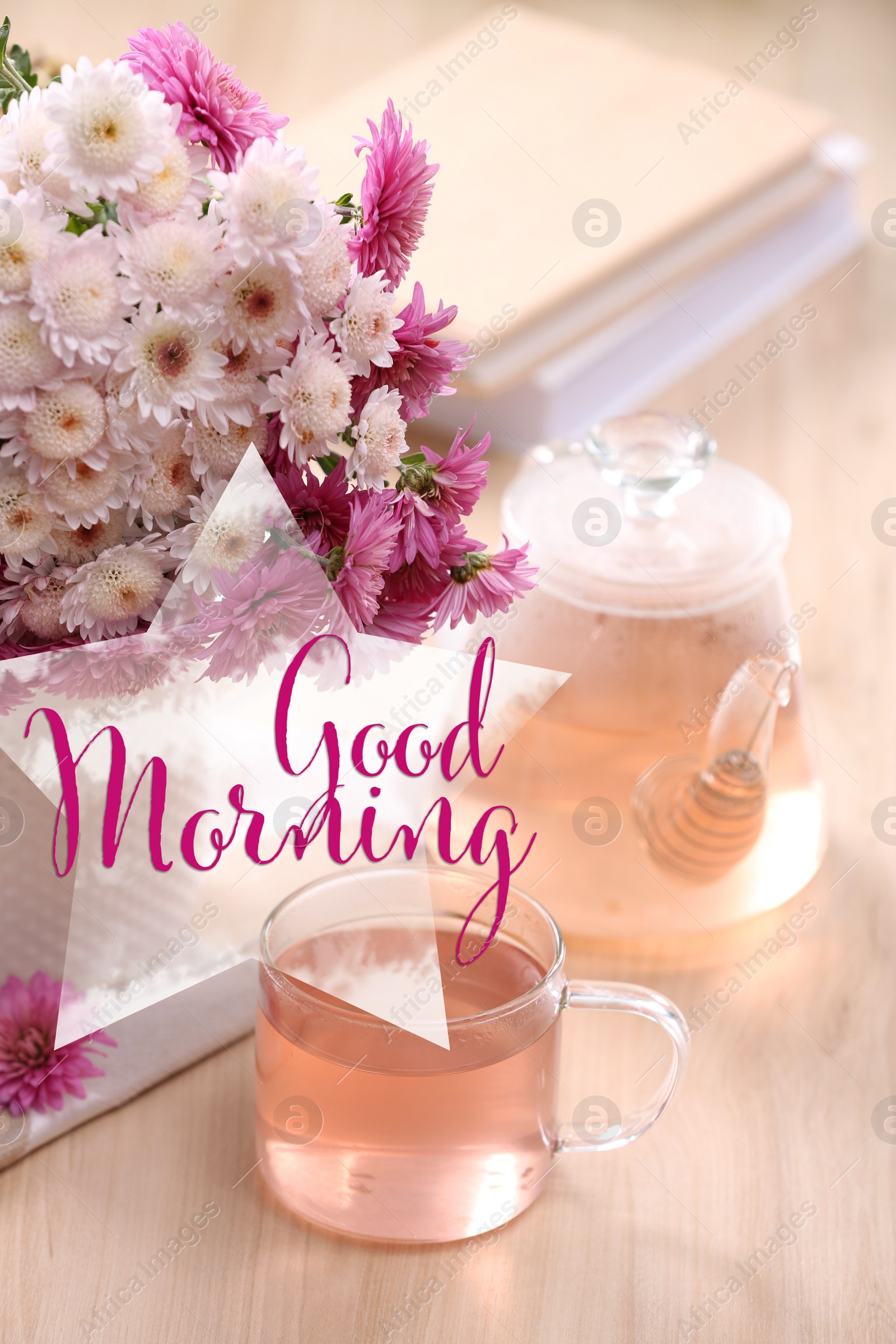 Image of Good morning! Fresh delicious herbal tea, books and beautiful bouquet on wooden table