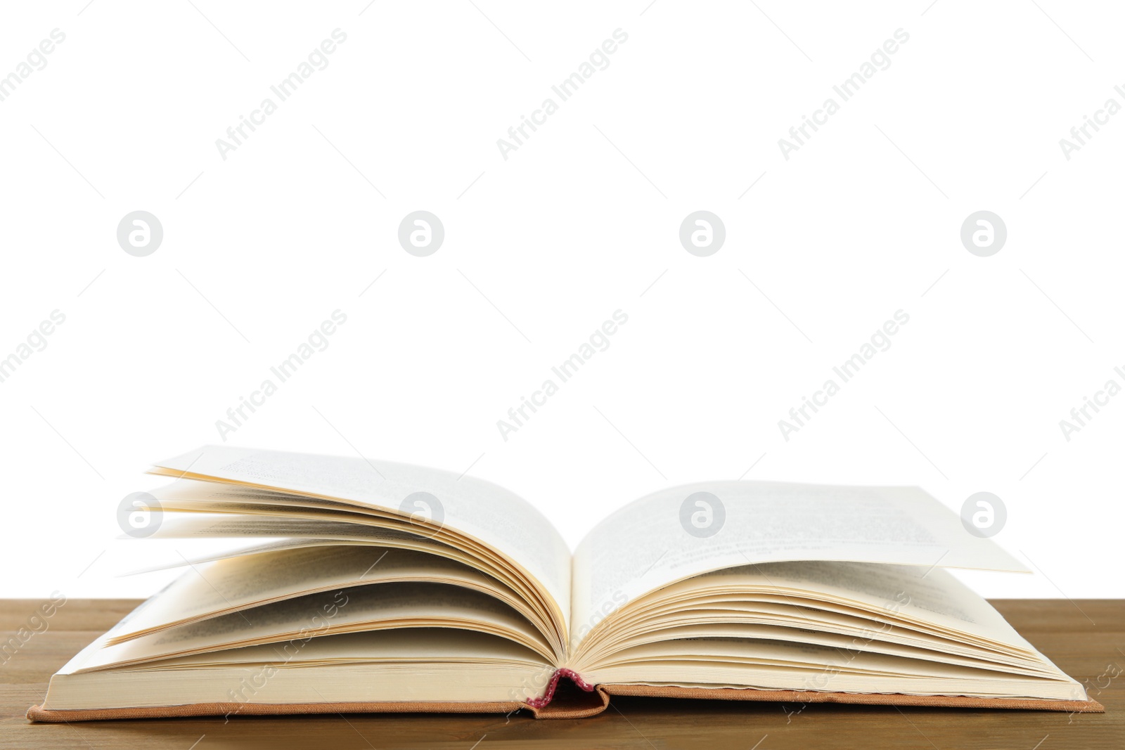 Photo of Open old hardcover book on wooden table