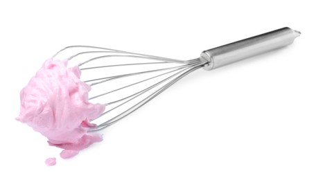 Photo of Balloon whisk with pink cream isolated on white