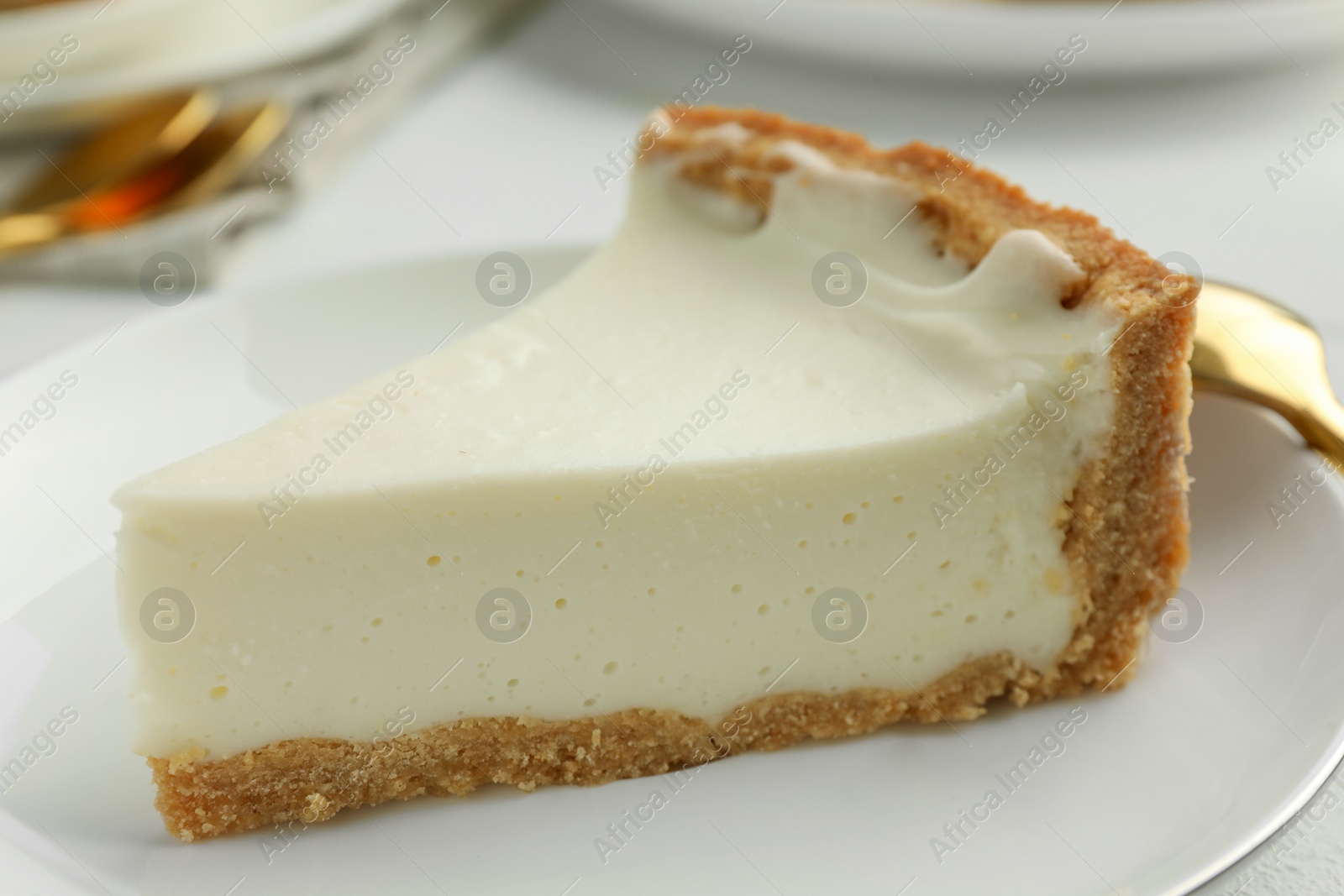 Photo of Piece of tasty vegan tofu cheesecake on plate, closeup