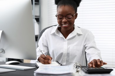 Professional accountant working at desk in office