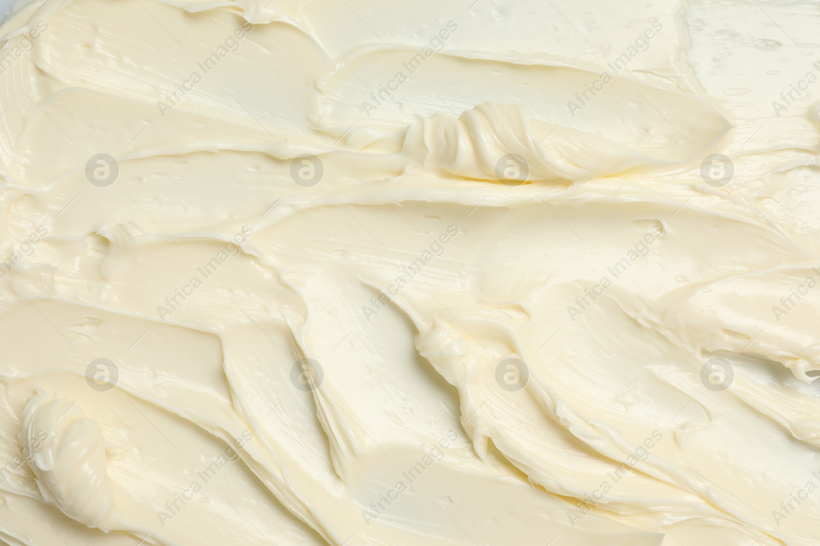 Photo of Texture of tasty butter as background, top view